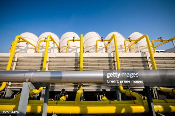 sets of cooling towers in conditioning systems - compressor stock pictures, royalty-free photos & images