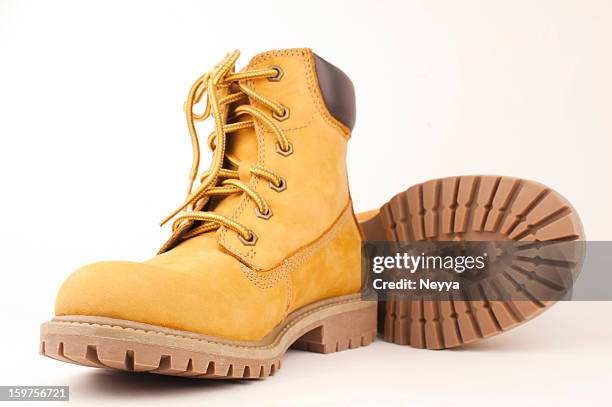 yellow boots - work boot stock pictures, royalty-free photos & images