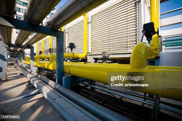 sets of cooling towers in conditioning systems - energy industry heat steam stock pictures, royalty-free photos & images