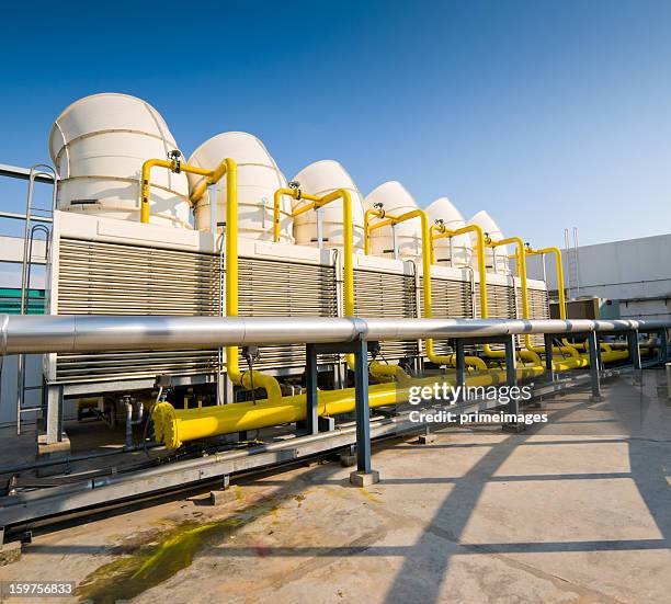 sets of cooling towers in conditioning systems - chillar stock pictures, royalty-free photos & images