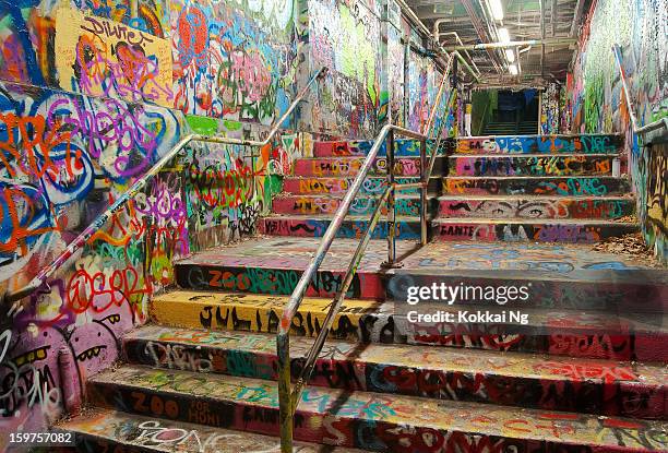 stairway tunnel filled with graffiti in university of sydney - street art stockfoto's en -beelden