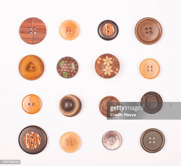 braune vintage-knöpfe - knöpfen stock-fotos und bilder