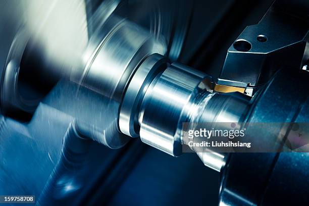 cnc lathe processing. - manufacturing machinery close up stock pictures, royalty-free photos & images