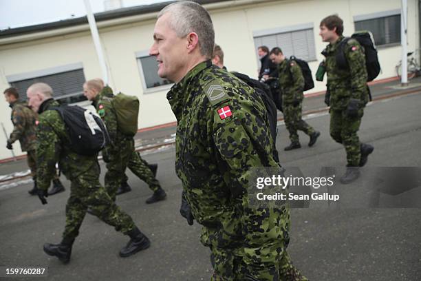 Asmall group of Danish troops join a contingent of approximately 240 soldiers of the German Bundeswehr preparing to board a plane for Turkey on...