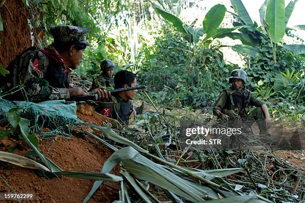 Rebel Kachin Independence Army 3rd Brigade soldiers secure an area on Hka Ya mountain in Kachin province on January 20, 2013. Kachin ethnic minority...