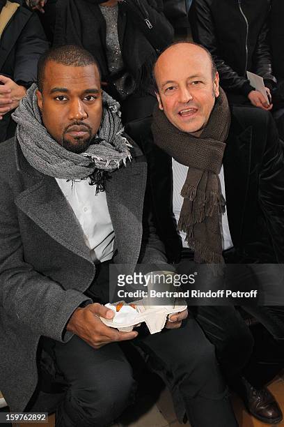 Kanye West and Thierry Andretta, CEO of Lanvin, attend the Lanvin Men Autumn / Winter 2013 show at Ecole Nationale Superieure Des Beaux-Arts as part...