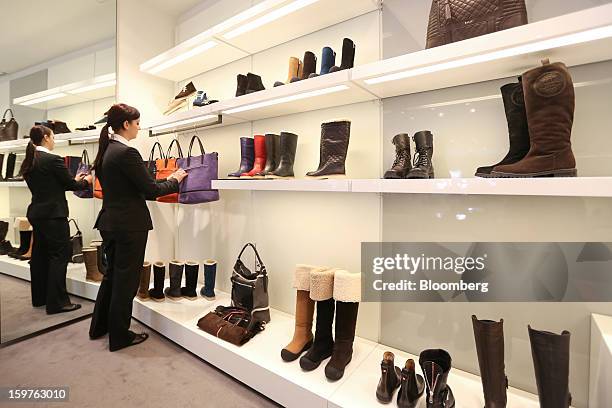 Shop assistant is seen adjusting a set of Bally handbags, produced by Bally the Swiss luxury brand, in their store in the town of Davos, Switzerland,...