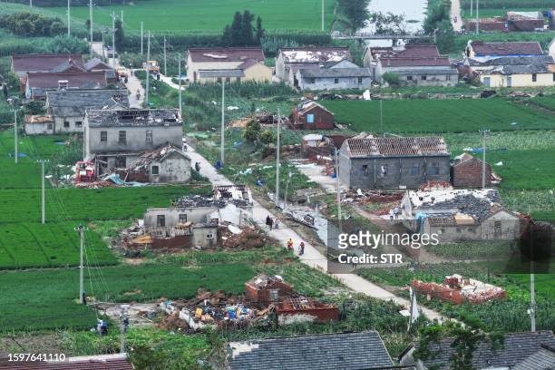 Damaged buildings are seen after a tornado hit the city of Yancheng, in China's eastern Jiangsu province province on August 14, 2023. / China OUT