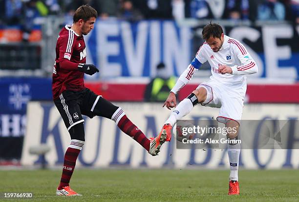 Heiko Westermann of Hamburg is challenged by Tomas Pekarik of Nuernberg during the Bundesliga match between 1. FC Nuernberg and Hamburger SV at Easy...