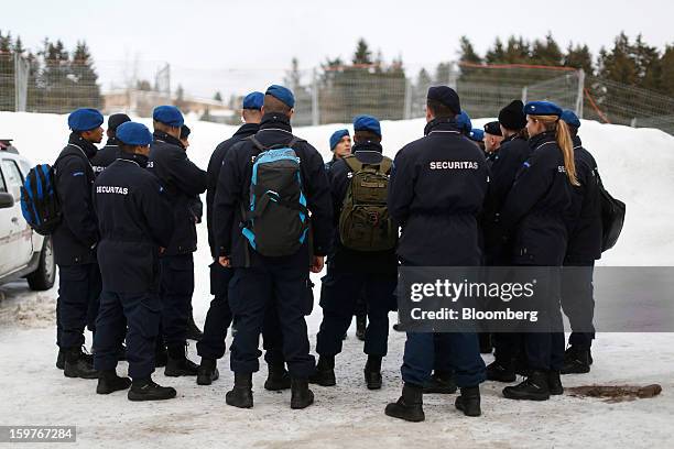 Security officers arrive at an entrance to the Congress Centre ahead of the World Economic Forum meeting in Davos, Switzerland, on Sunday, Jan. 20,...