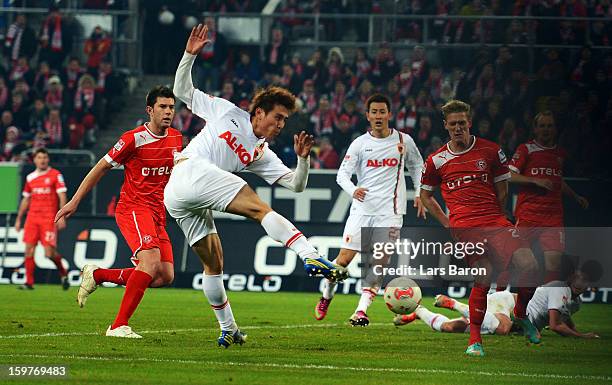 Ja Cheol Koo of Augsburg scores his teams second goal during the Bundesliga match between Fortuna Duesseldorf 1895 and FC Augsburg at Esprit-Arena on...