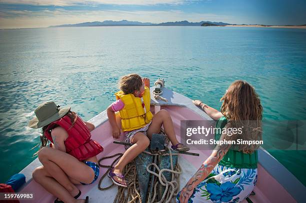 kids on the bow of a moving boat - isla espiritu santo stock pictures, royalty-free photos & images