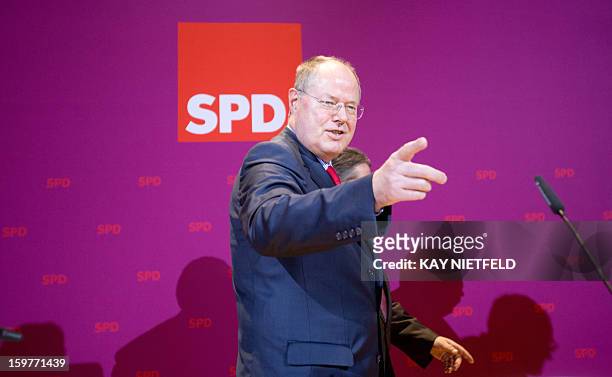 Chancellor candidate Peer Steinbrueck address supporters in Berlin on January 20, 2013 on polling day of the local elections in the central German...