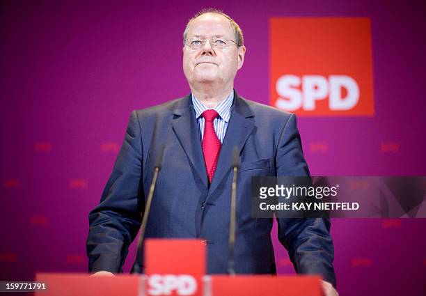 Chancellor candidate Peer Steinbrueck addresses supporters in Berlin on January 20, 2013 on polling day of the local elections in the central German...