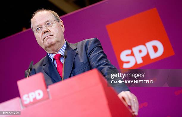 Chancellor candidate Peer Steinbrueck addresses supporters in Berlin on January 20, 2013 on polling day of the local elections in the central German...