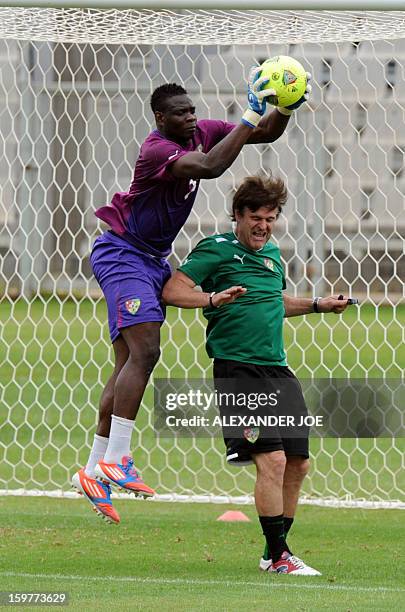 Togo's French Coach Didier Six and Goalkeeper Kossi Agassa play during a training session in Moruleng on January 20, 2013 at Moruleng Stadium. Togo...
