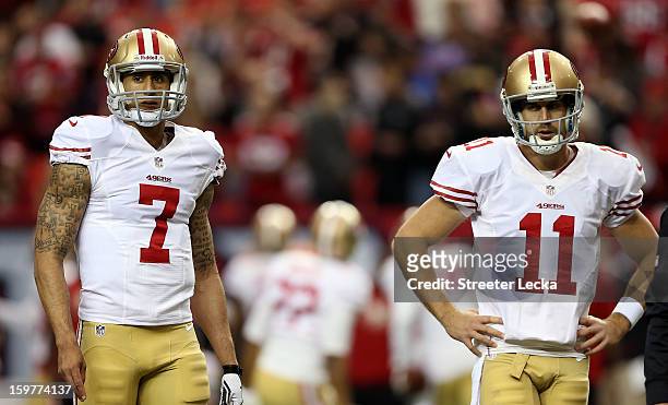 Quarterbacks Colin Kaepernick and quarterback Alex Smith of the San Francisco 49ers warm up before taking on the Atlanta Falcons in the NFC...