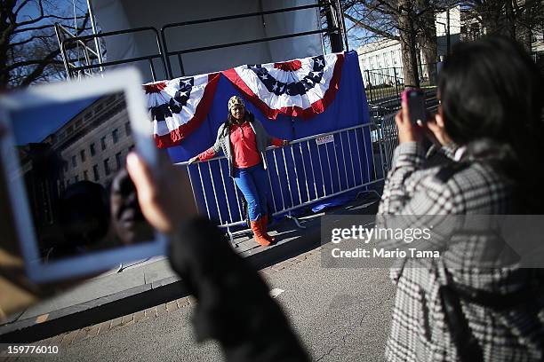 Yvette Adams poses in front of inaugural bunting as Washington prepares for U.S. President Barack Obama's second inauguration on January 20, 2013 in...