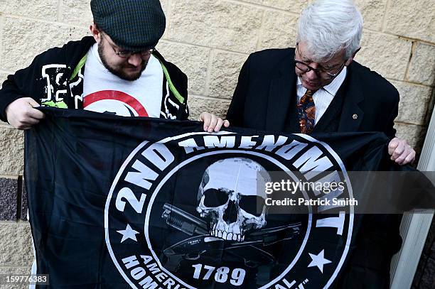 President David Keene looks at a supporter's flag during the Delaware State Sportsmen's Association Second Amendment rally at the Modern Maturity...