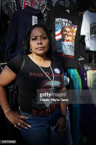 Obama supporter Traci Shipp poses at a souvenir stand as Washington prepares for President Barack Obama's second inauguration on January 20, 2013 in...