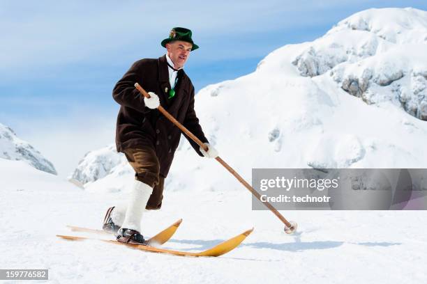 portrait of elegant vintage skier in the mountains - telemark skiing stockfoto's en -beelden