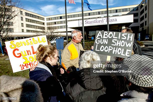 Small group of demonstrators picketed outside the eighth annual East Coast Fine Arms Show, held at the Stamford Plaza Hotel in Stamford, Connecticut....