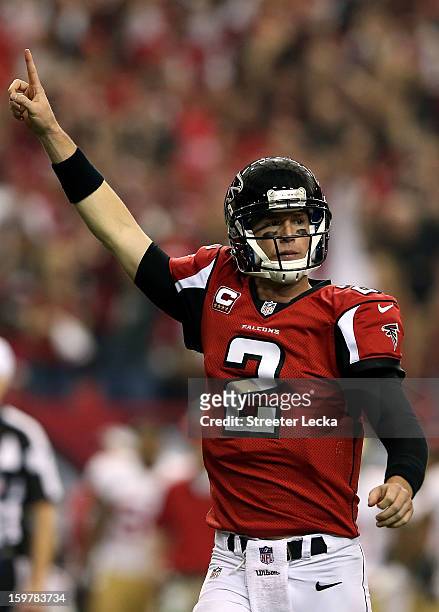 Quarterback Matt Ryan of the Atlanta Falcons celebrates after throwing a 20-yard touchdown to wide receiver Julio Jones in the second quarter against...