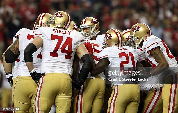Quarterback Colin Kaepernick of the San Francisco 49ers calls a play in the huddle against the Atlanta Falcons in the NFC Championship game at the...