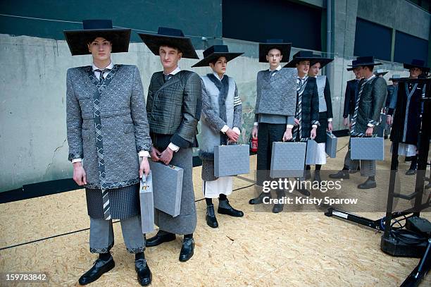 Models are seen backstage before the Thom Browne Menswear Autumn / Winter 2013/14 show as part of Paris Fashion Week on January 20, 2013 in Paris,...
