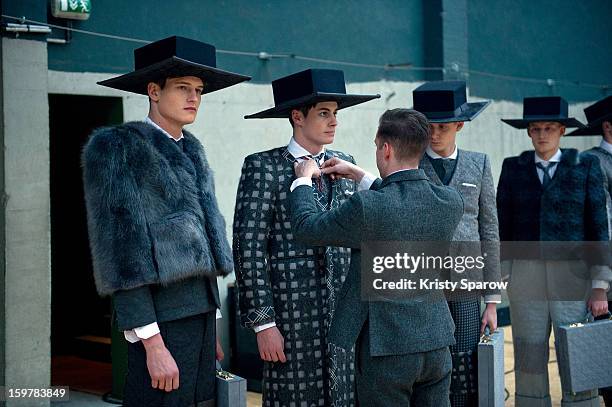 Models are seen backstage before the Thom Browne Menswear Autumn / Winter 2013/14 show as part of Paris Fashion Week on January 20, 2013 in Paris,...