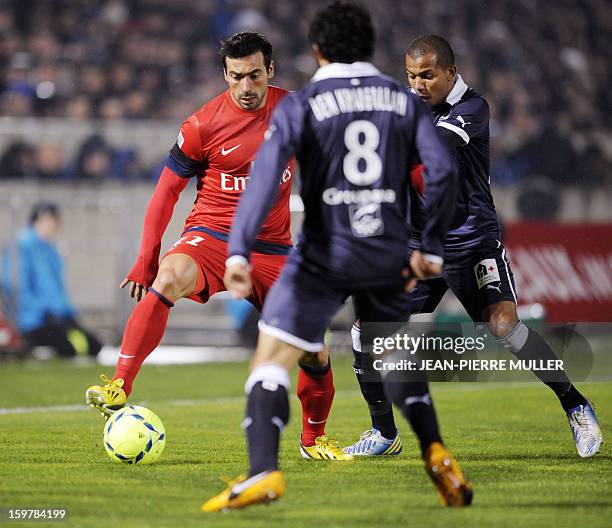 Paris-Saint-Germain's forward Ezequiel Lavezzi vies with Bordeaux's Fahid Ben Khalfallah during the French L1 football match Girondins de Bordeaux vs...