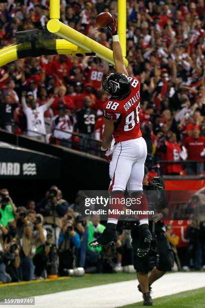 Tight end Tony Gonzalez of the Atlanta Falcons dunks the ball over the goal post after catching a 10-yard touchdown in the second quarter against the...