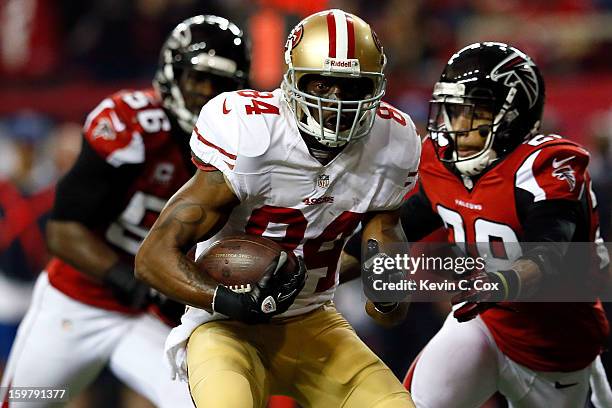 Wide receiver Randy Moss of the San Francisco 49ers runs after a catch in the third quarter against the Atlanta Falcons in the NFC Championship game...