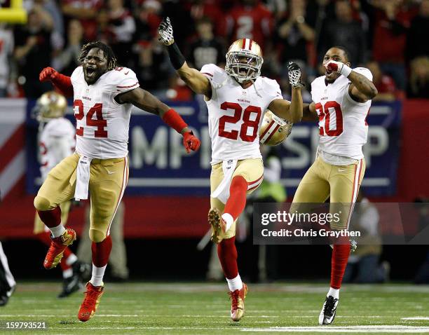 Anthony Dixon, defensive back Darcel McBath and defensive back Perrish Cox of the San Francisco 49ers react after stopping the Atlanta Falcons on...