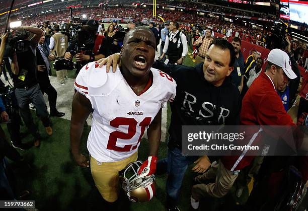 Running back Frank Gore of the San Francisco 49ers and agent Drew Rosenhaus celebrate after the 49ers defeated the Atlanta Falcons 28-24 in the NFC...