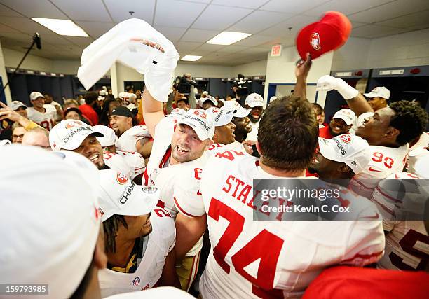 The San Francisco 49ers celebrate in the locker room after defeating the Atlanta Falcons 28-24 in the NFC Championship game at the Georgia Dome on...