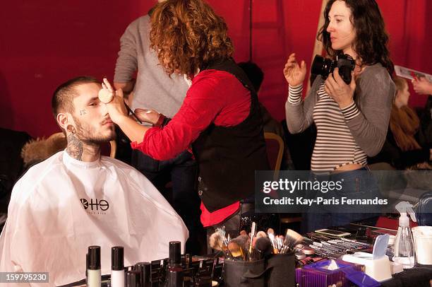 Model has his make-up done backstage before the Rynshu Men Autumn / Winter 2013 show as part of Paris Fashion Week on January 20, 2013 in Paris,...