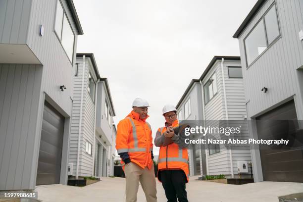 property developers inspecting houses after development. - real estate developer stock pictures, royalty-free photos & images