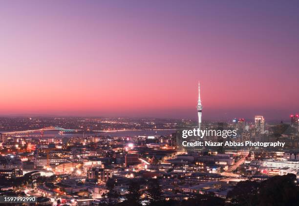 auckland skyline at night. - auckland region stock pictures, royalty-free photos & images