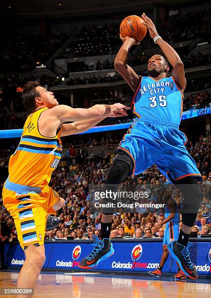 Kevin Durant of the Oklahoma City Thunder takes a shot and is fouled by Danilo Gallinari of the Denver Nuggets at the Pepsi Center on January 20,...