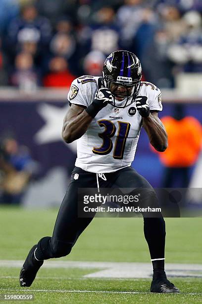 Bernard Pollard of the Baltimore Ravens celebrates a fumble recovery against Stevan Ridley of the New England Patriots in the fourth quarter during...