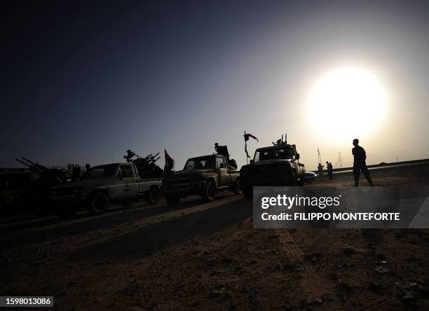 Libyan rebels guard an advanced position near Al-Sadaadi on the road between Misrata and Sirte on August 31 as some 60 countries prepared to meet in...