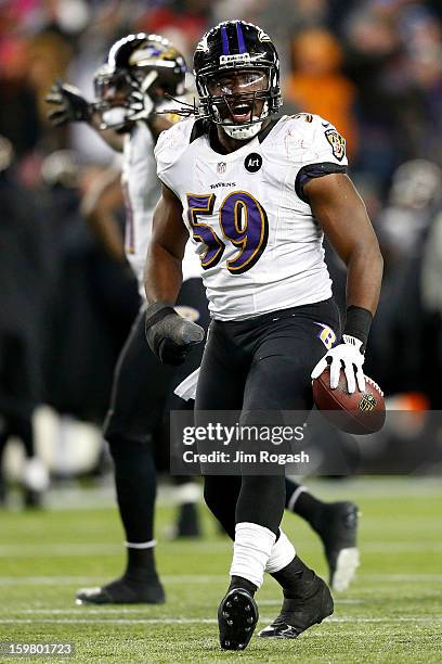 Dannell Ellerbe of the Baltimore Ravens celebrates after intercepting a pass by Tom Brady of the New England Patriots in the fourth quarter during...