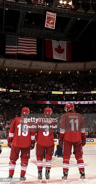 Captain Shane Doan of the Phoenix Coyotes along with assistant captains Keith Yandle and Martin Hanzel watch as the 2011-12 Pacific Division...