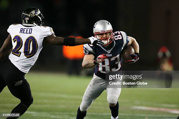 New England Patriots player Wes Welker eludes the Baltimore Ravens' Ed Reed for a long gain in the second quarter as the New England Patriots hosted...