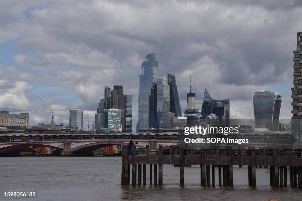 General view of the City of London skyline on a partly cloudy day.