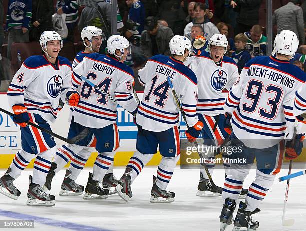 Edmonton Oilers skate to congratulate Ales Hemsky who scored the shootout winning goal against the Vancouver Canucks during their NHL game at Rogers...