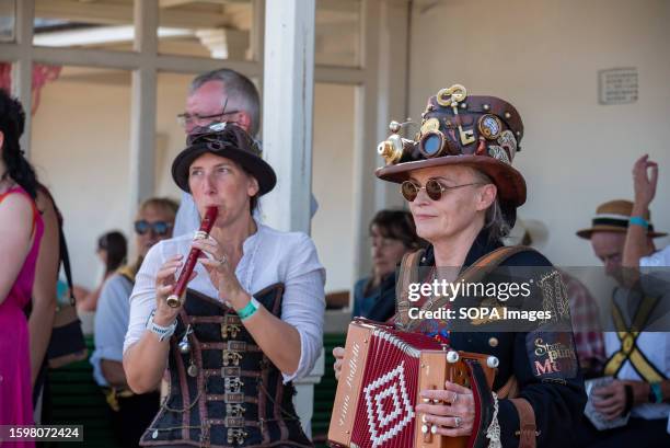 Steampunk musicians are seen playing their instruments during the Folk Week festival. Broadstairs holds its 57th Folk Week festival this year. It is...