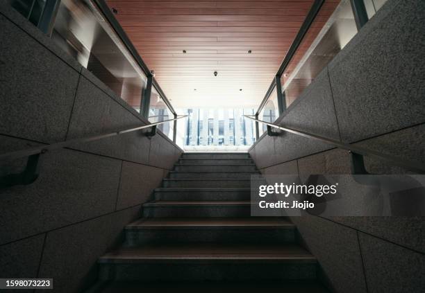 underground walkway exit stairs - corridor light at end stock pictures, royalty-free photos & images