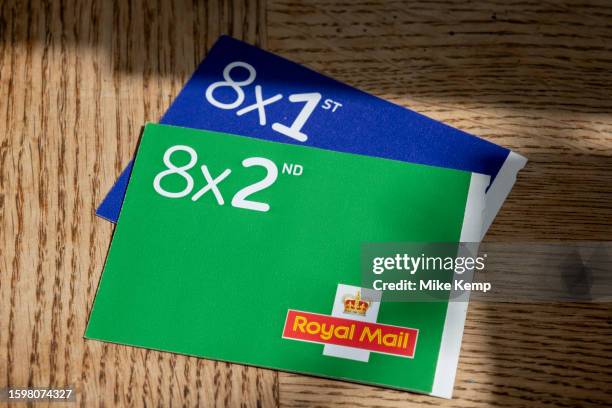Books of barcoded Royal Mail 1st class postage stamps with the Royal Mail logo on 29th July 2023 in St Dogmaels, Wales, United Kingdom. Non barcoded...